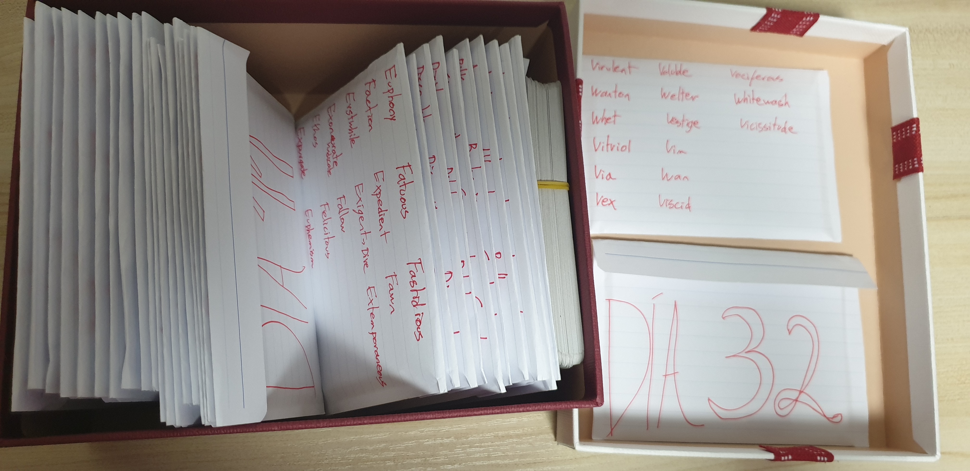 Box of GRE vocabulary cards with handwritten English vocabulary notes.