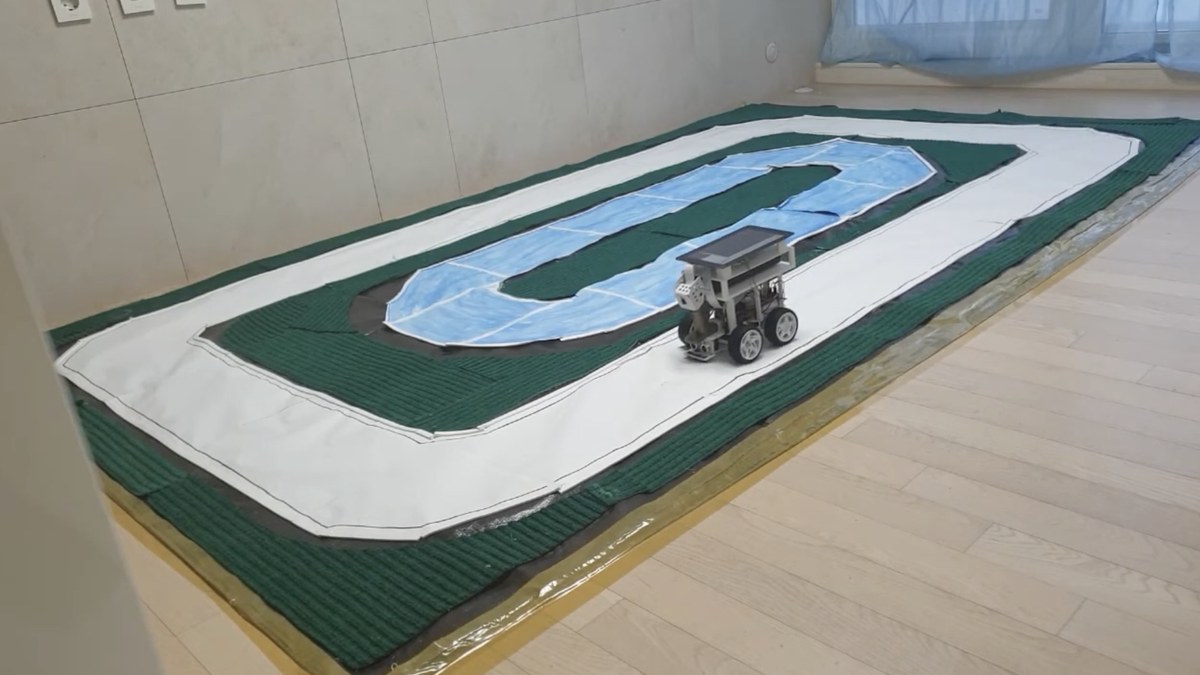The self-built robot car on the physical training track used for behavioral cloning.